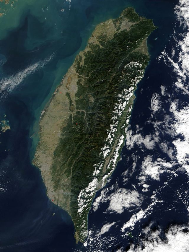 Satellite image of Taiwan: shallow strait to the west, mountainous island, deep Pacific to the east